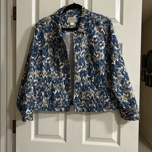 Women’s jacket.    Blues and tans, long sleeves. Snaps.  detailed pockets.